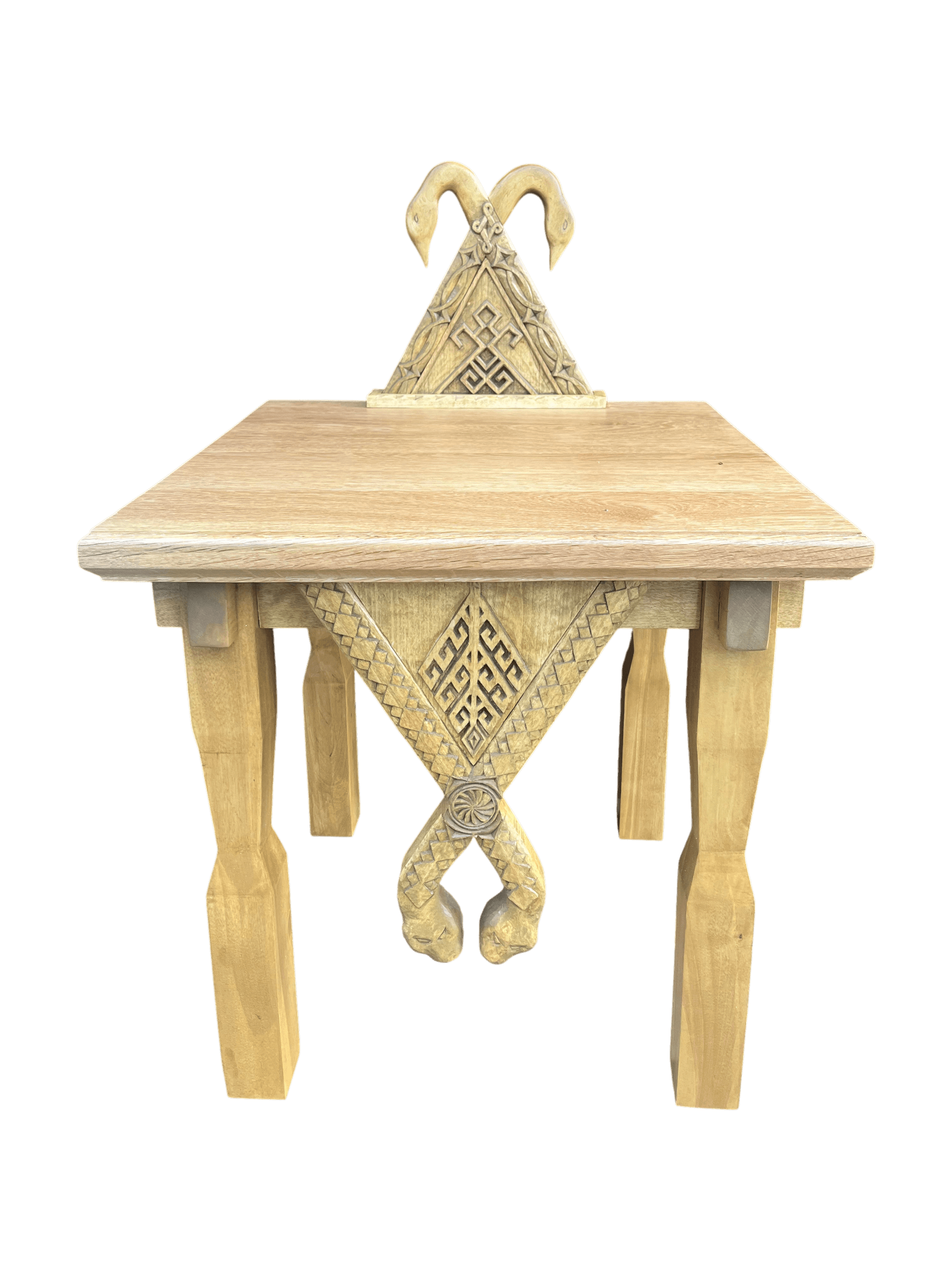 Hand-carved oak altar: a triangular structure with swans at the crest and serpents on the pendant.